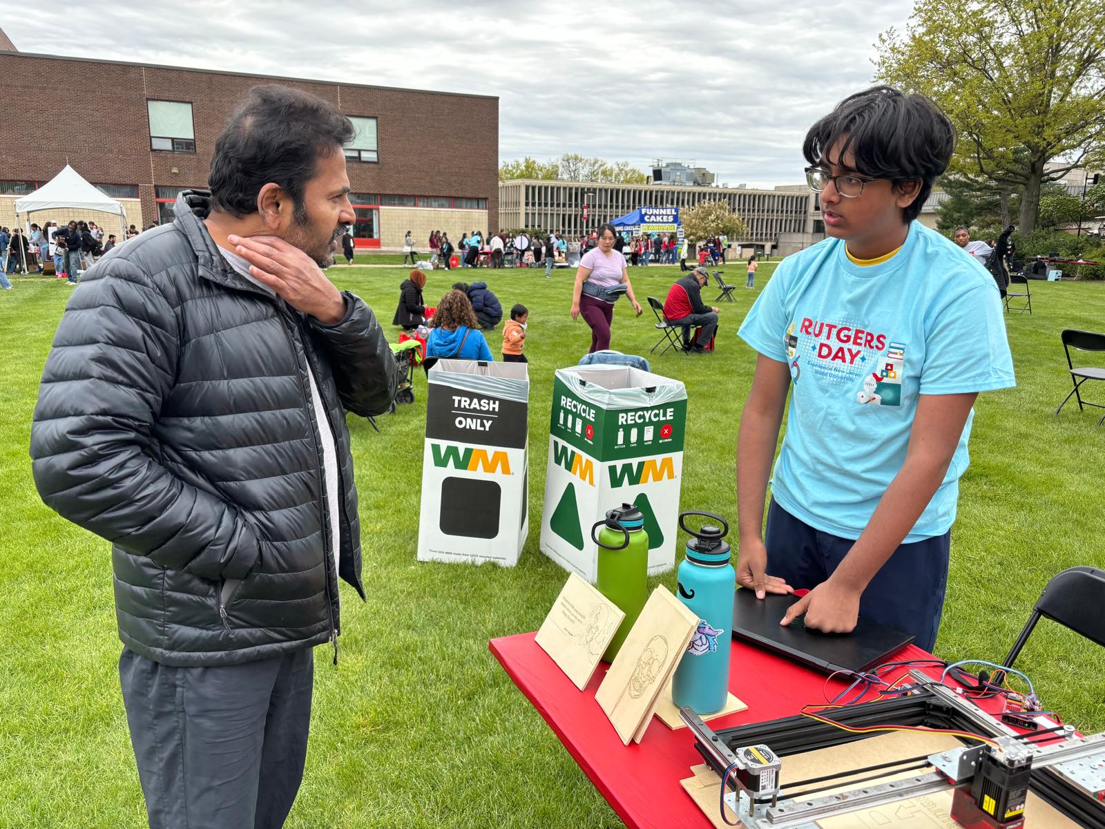 Pen plotter and laser engraver together at the Rutgers Day event.